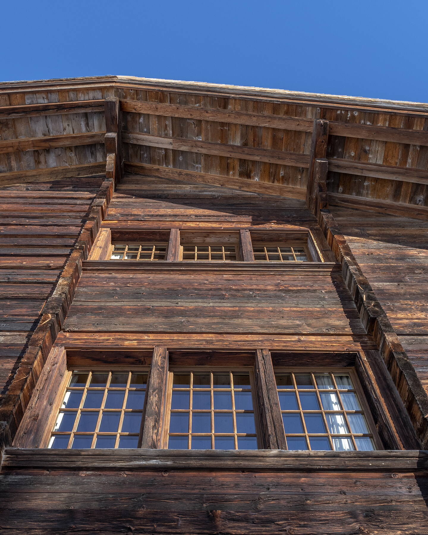 Chalet in antique wood  by Arnold Reuteler Holzbau AG Gstaad